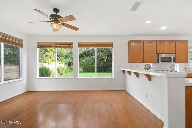 a view of a kitchen with a sink cabinet and a window