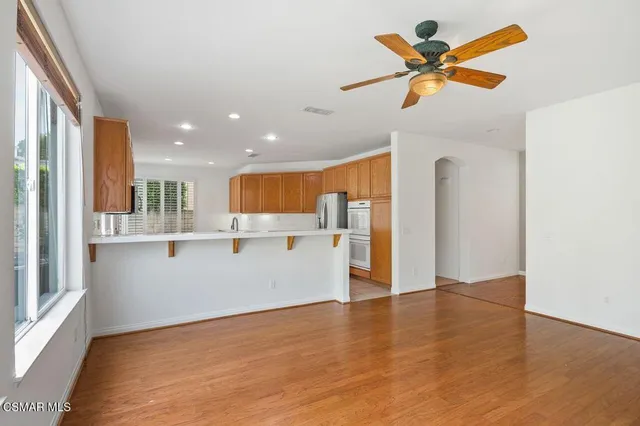 a view of a kitchen with a sink and a window