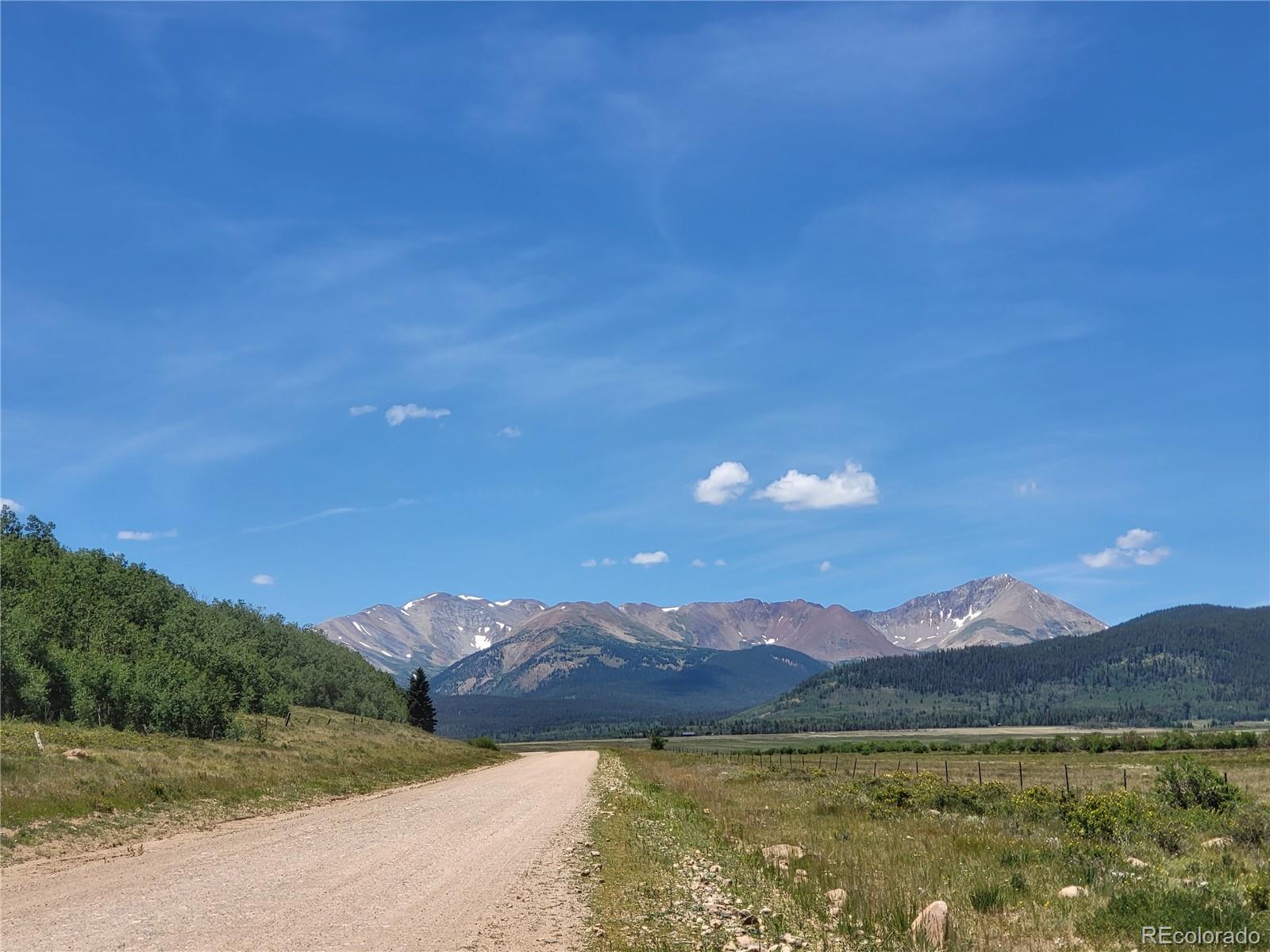 0 Michigan Hill Road Jefferson, CO 80456 - Photo 39 of 49 a view of a town with mountains in the background