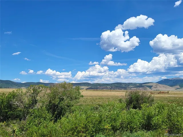 a view of a lake with sunset