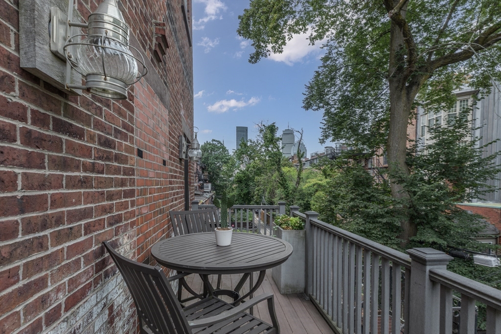 41 Worcester Street, Unit 2 Boston, MA 02118 - Photo 20 of 27 a view of a balcony with a table and chairs