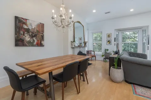 a view of a dining room with furniture window and outside view
