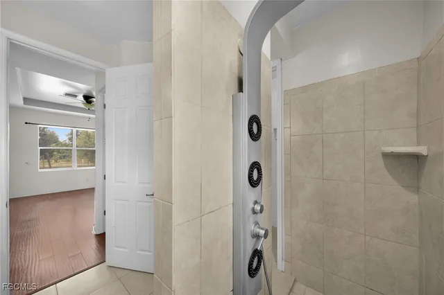 a bathroom with a shower and a sink