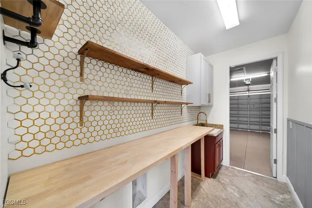 a kitchen with a sink and cabinets