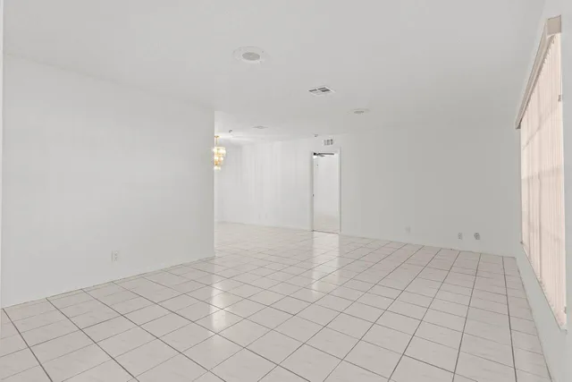 an empty room with white walls