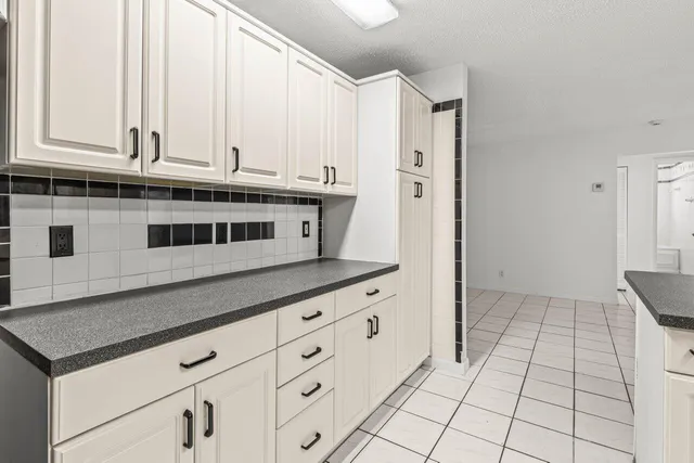 a kitchen with stainless steel appliances a sink and a cabinets