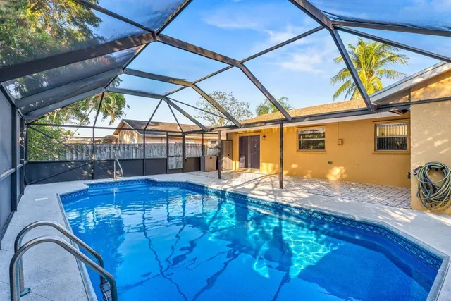 a view of a swimming pool with a patio