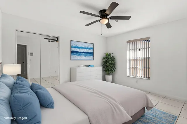 a bedroom with a bed furniture and a window