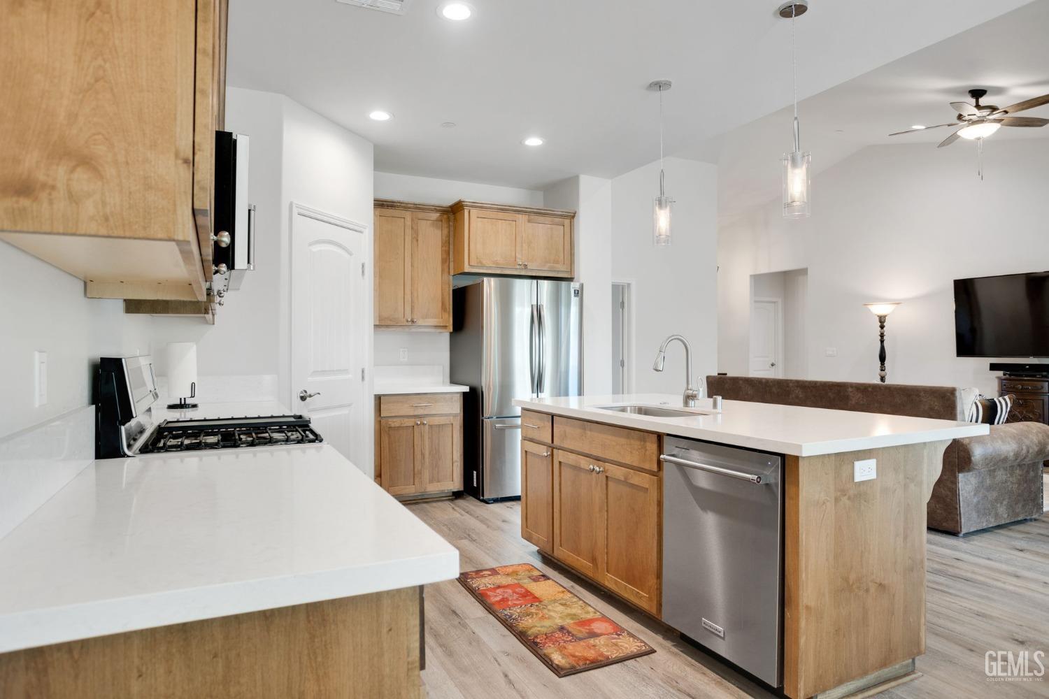 Undisclosed Address Tehachapi, CA 93561 - Photo 13 of 41 a kitchen with a sink stove and refrigerator