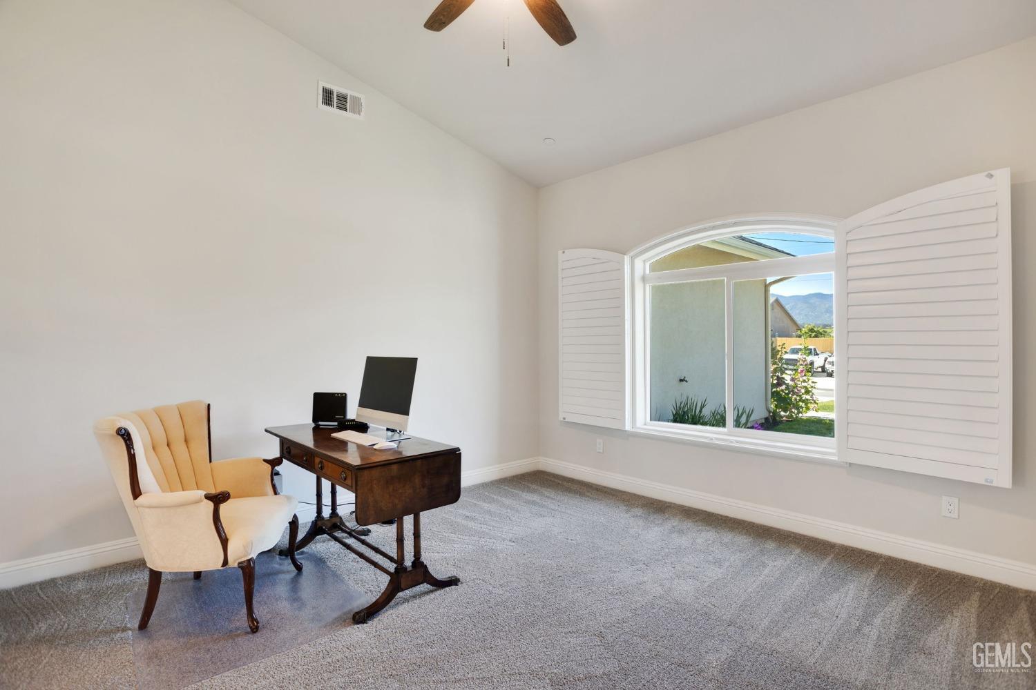 Undisclosed Address Tehachapi, CA 93561 - Photo 19 of 41 a view of a workspace with furniture and a window