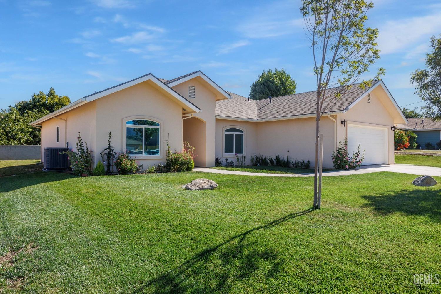 Undisclosed Address Tehachapi, CA 93561 - Photo 2 of 41 a view of a house with backyard and a garden