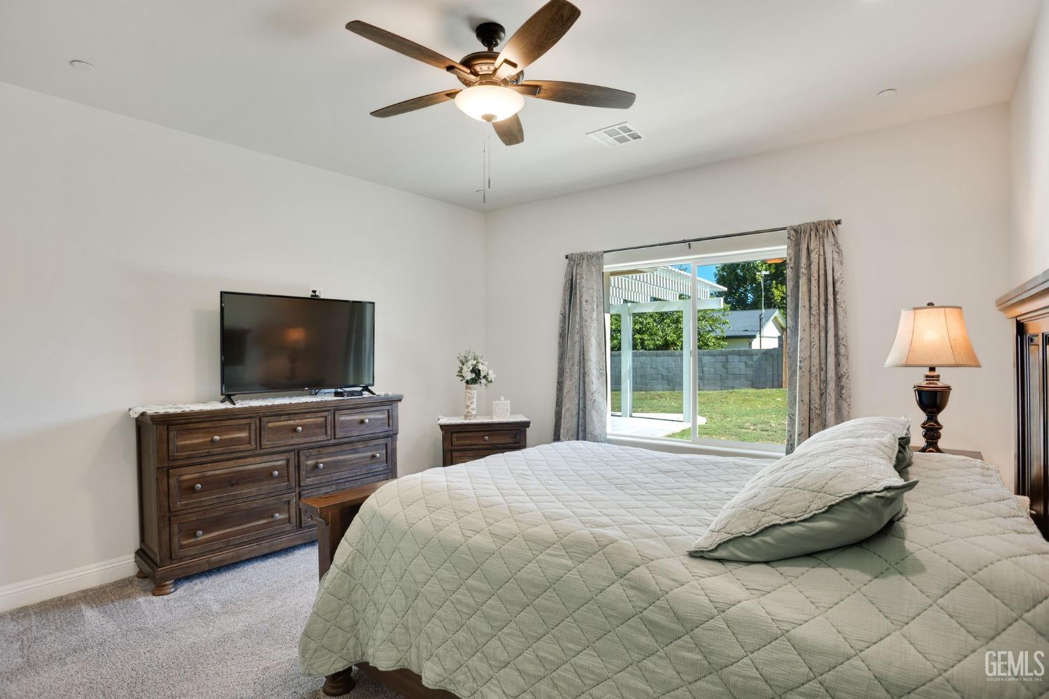 Undisclosed Address Tehachapi, CA 93561 - Photo 23 of 41 a bedroom with a bed and a flat screen television