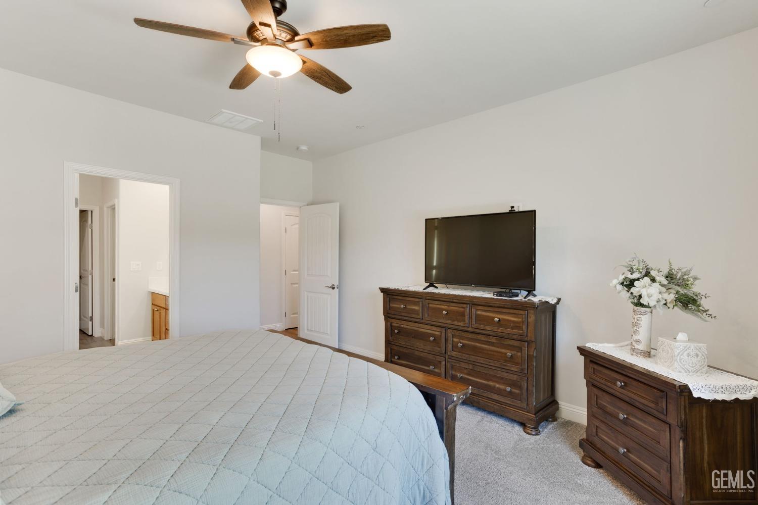 Undisclosed Address Tehachapi, CA 93561 - Photo 24 of 41 a bedroom with a bed and a flat screen tv