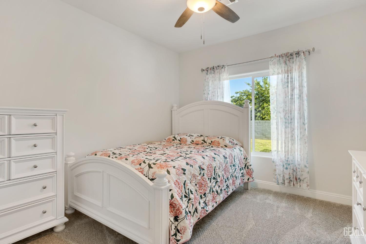 Undisclosed Address Tehachapi, CA 93561 - Photo 30 of 41 a bedroom with a bed and a window