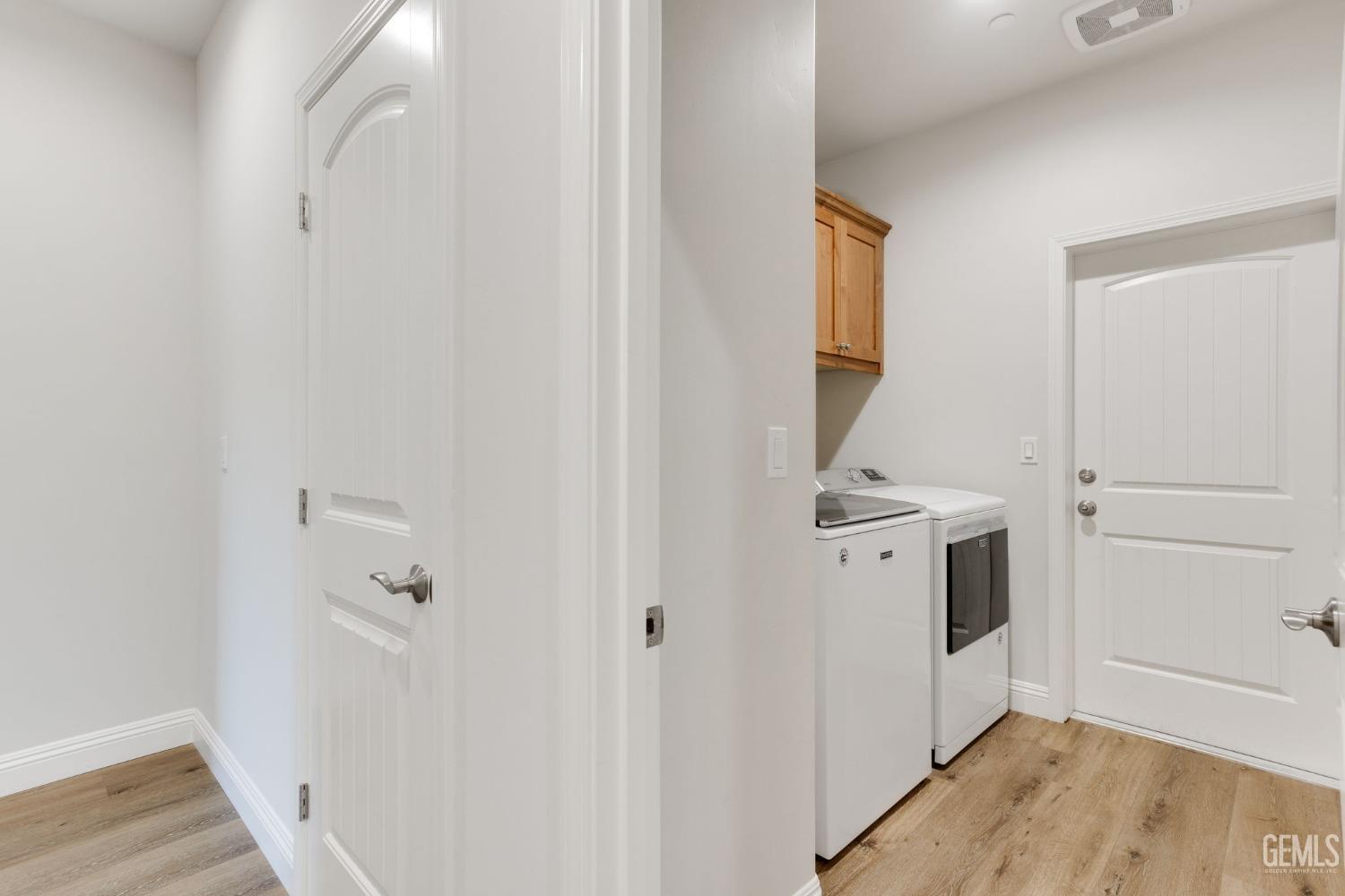 Undisclosed Address Tehachapi, CA 93561 - Photo 33 of 41 a view of a hallway with closet and wooden floor