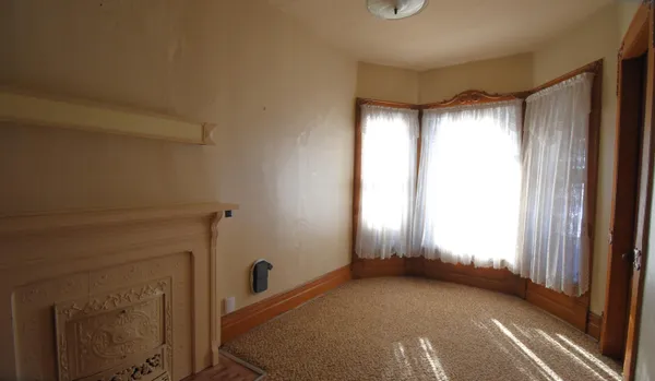 a view of an empty room and window