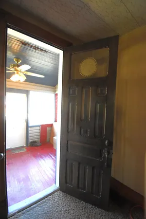 a view of an empty room with a window