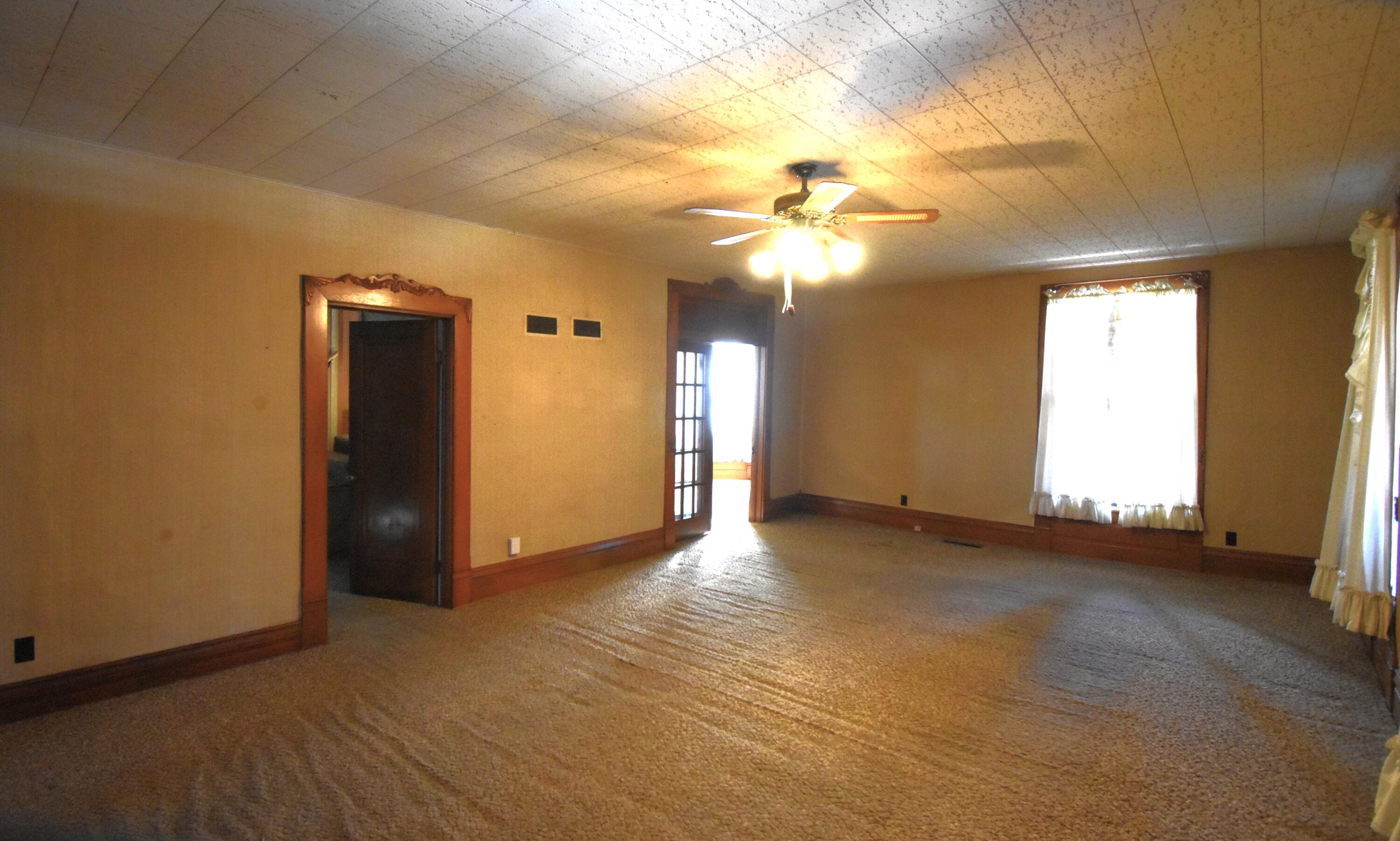 301 South Van Rensselaer Street Rensselaer, IN 47978 - Photo 18 of 42 an empty room with windows and fan
