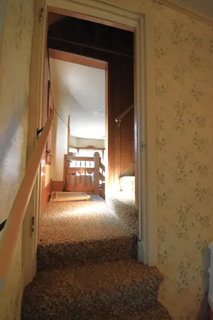 a view of a hallway view with staircase