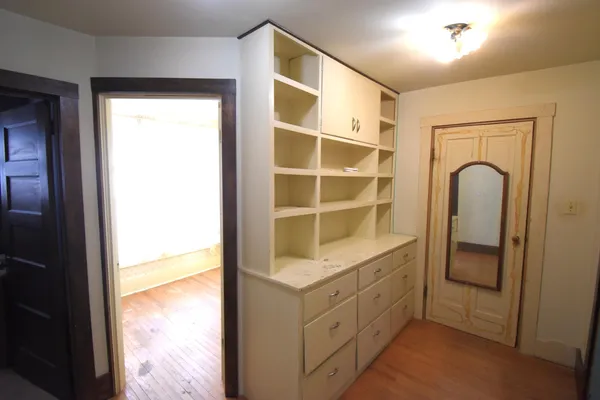 a room with closet and mirror