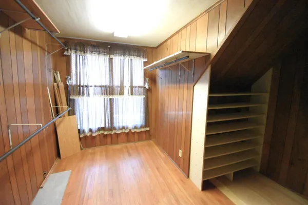 a view of front door with wooden floor and stairs