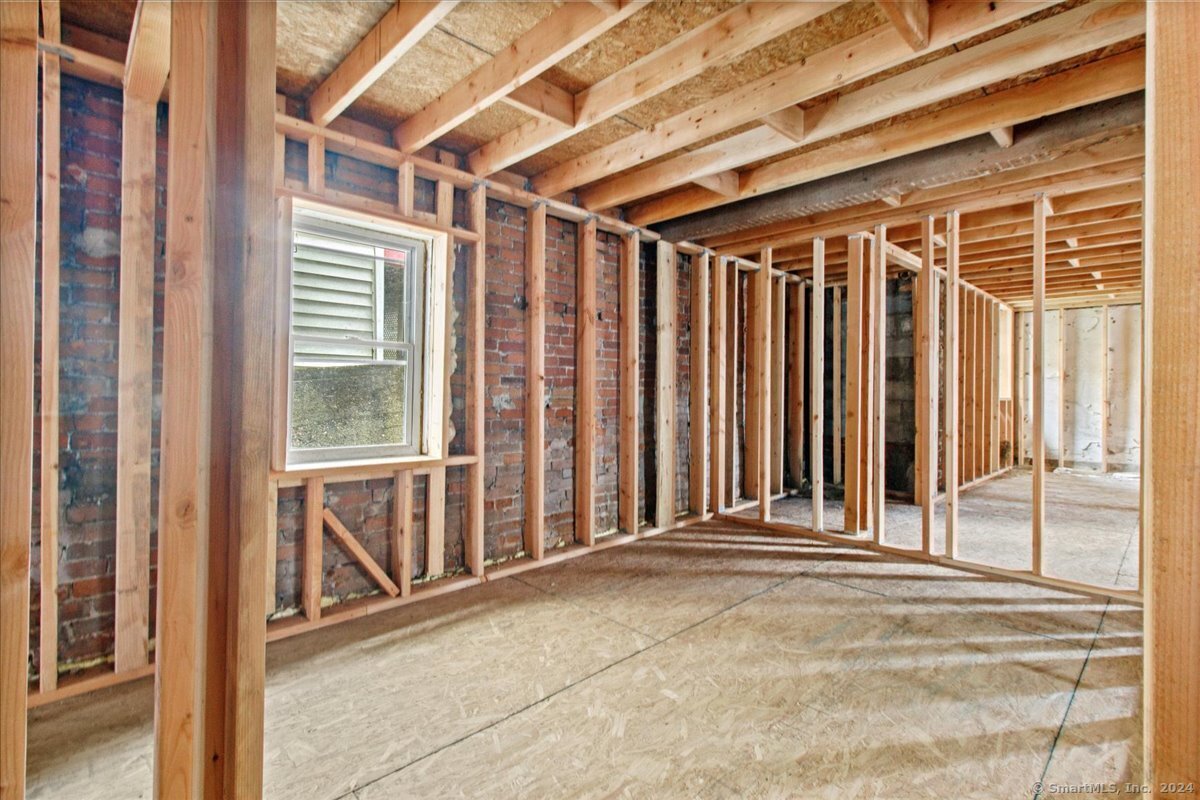 220 Franklin Street Norwich, CT 06360 - Photo 11 of 21 a view of a porch with wooden floor and fence