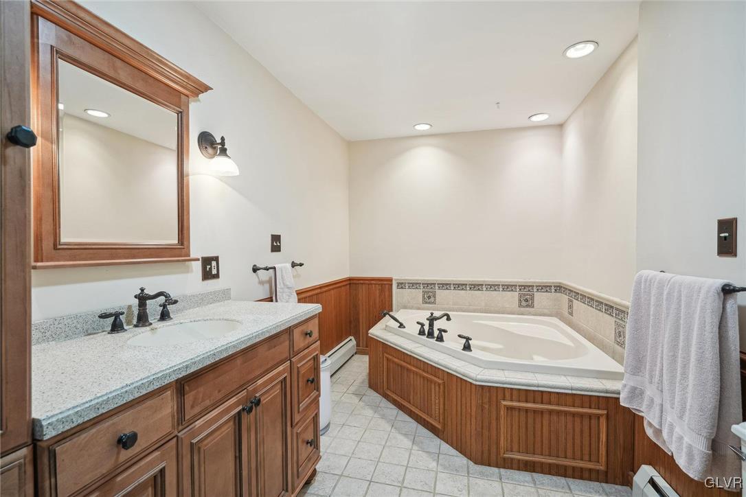 2426 Keeler Road Bath, PA 18014 - Photo 18 of 40 a bathroom with a tub sink and mirror