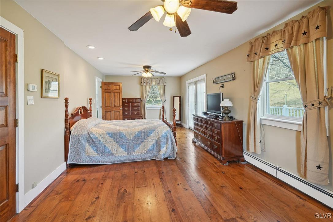 2426 Keeler Road Bath, PA 18014 - Photo 22 of 40 a bed room with a bed and a chandelier