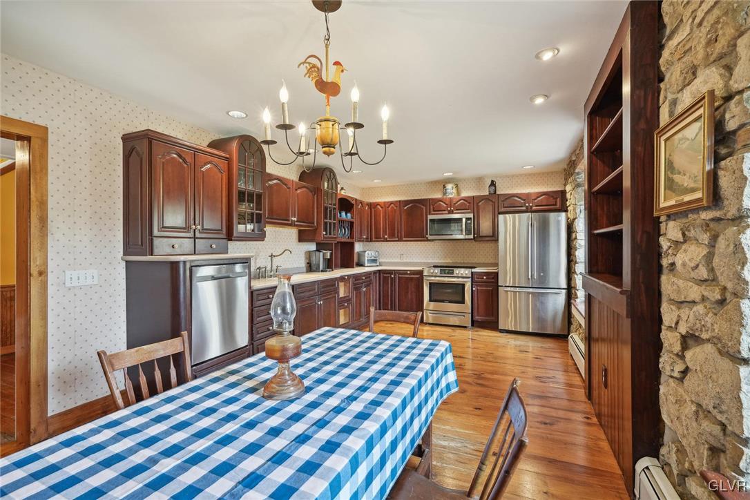 2426 Keeler Road Bath, PA 18014 - Photo 5 of 40 a kitchen with stainless steel appliances granite countertop a sink dishwasher stove and refrigerator