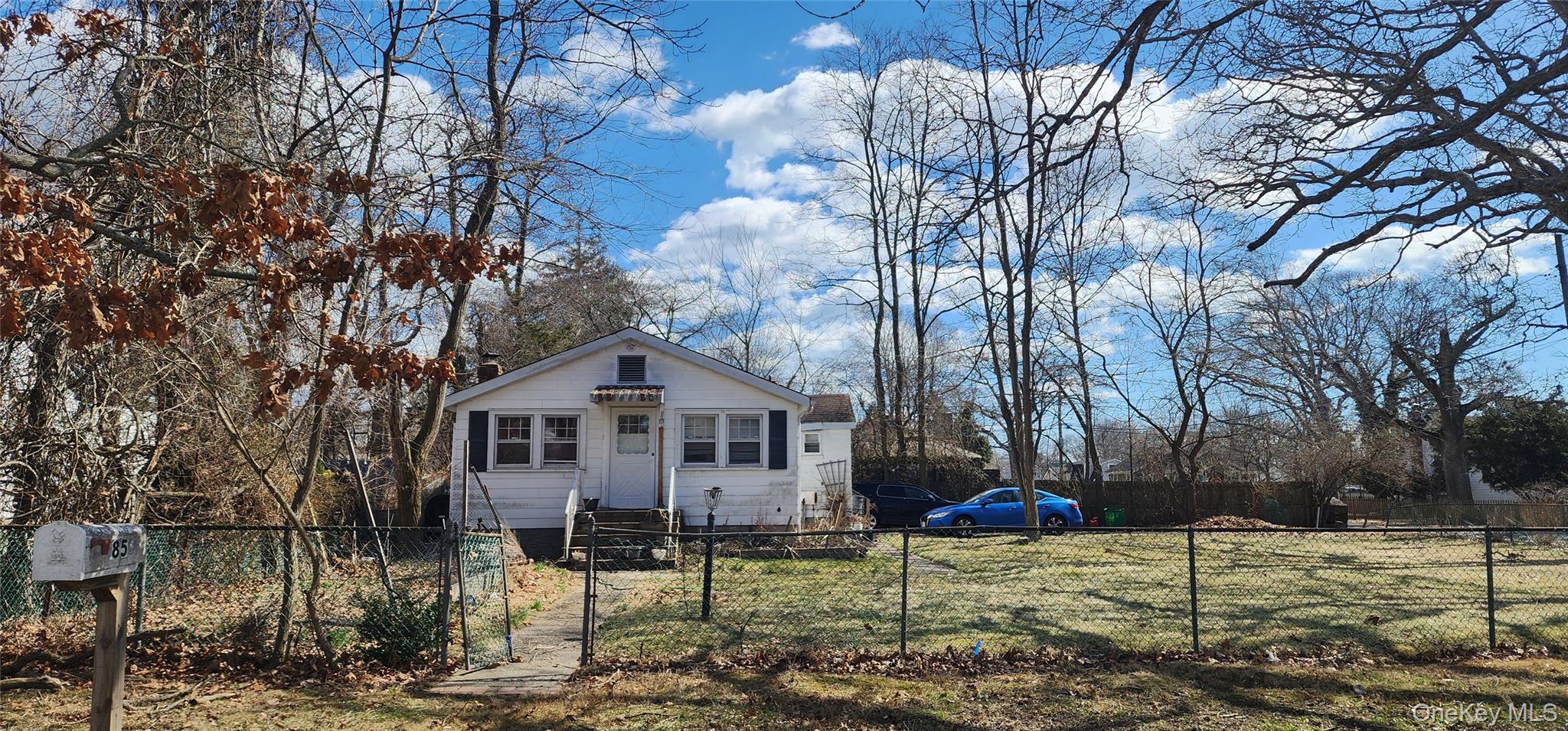85 Woodside Road Mastic Beach, NY 11951 - Photo 1 of 2 a view of a town with large tree