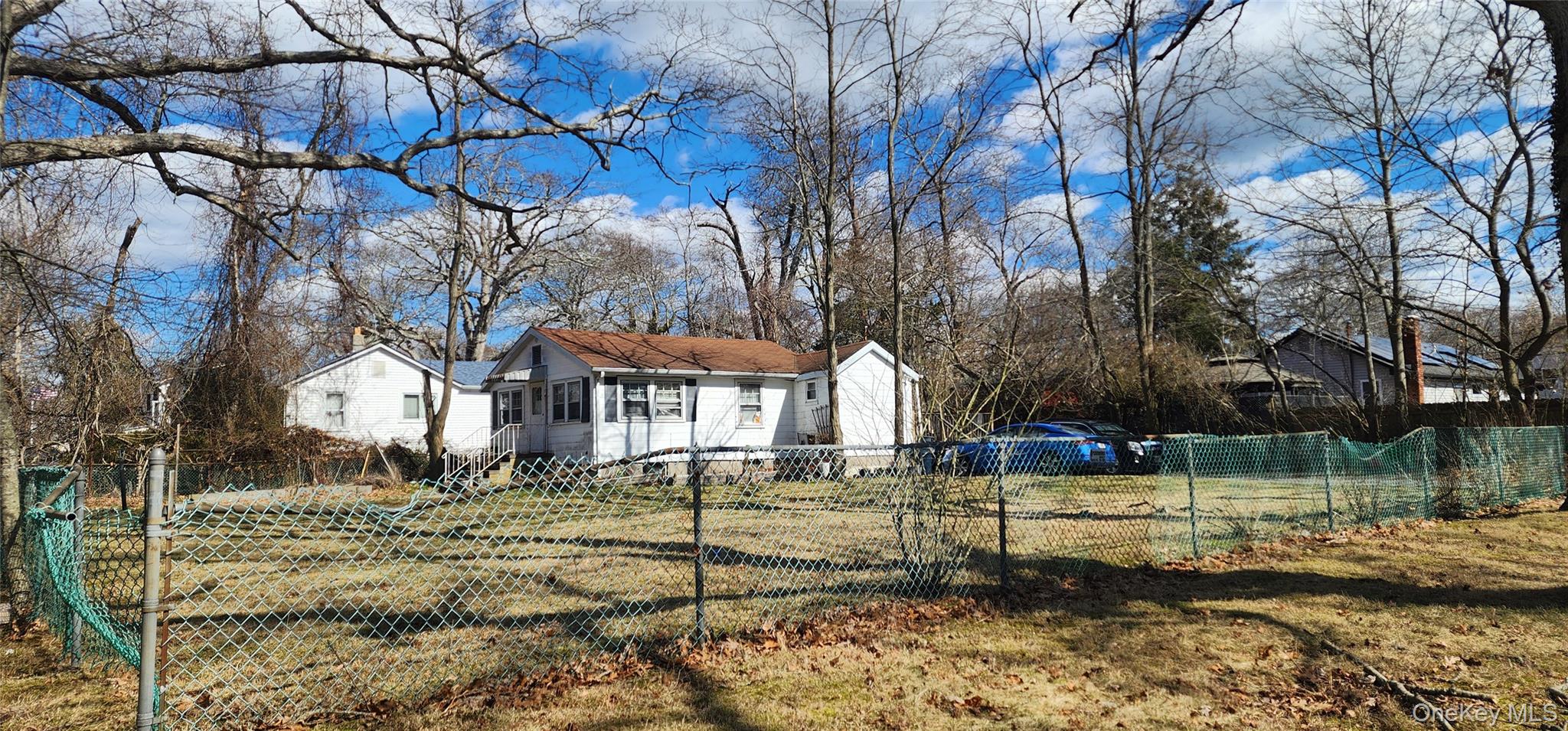 85 Woodside Road Mastic Beach, NY 11951 - Photo 2 of 2 a front view of a house with a yard