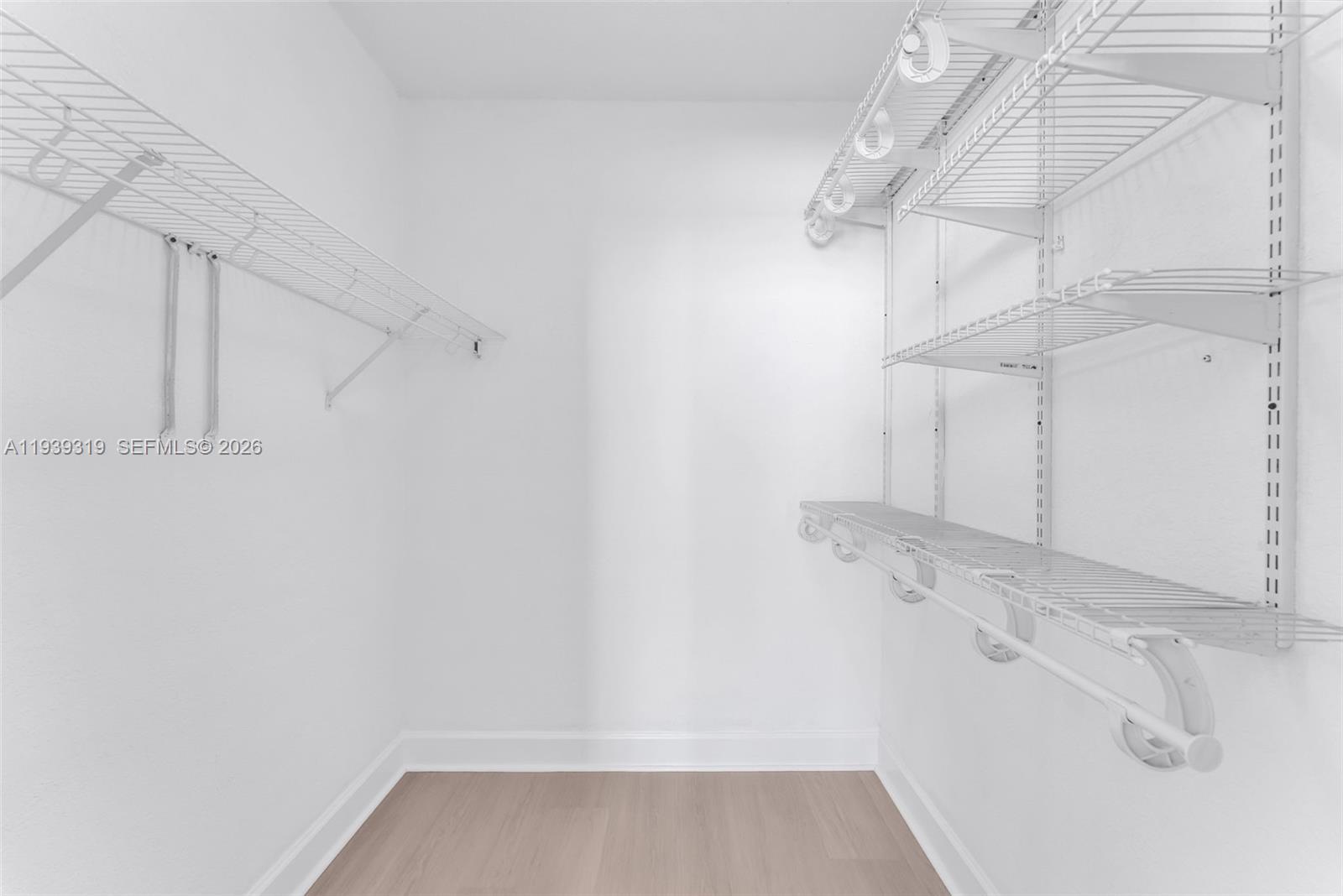 401 69th Street, Unit 1201 Miami Beach, FL 33141 - Photo 19 of 25 a view of a room with racks on the wall