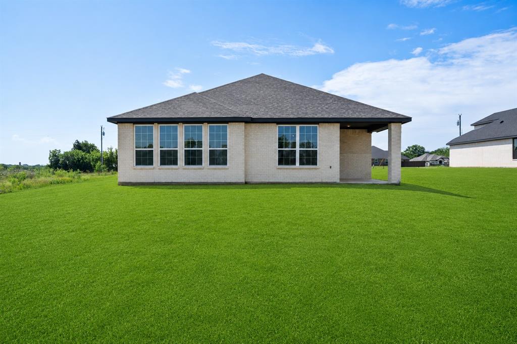 3400 Dobbins Road Corsicana, TX 75110 - Photo 32 of 40 a view of a house with a yard
