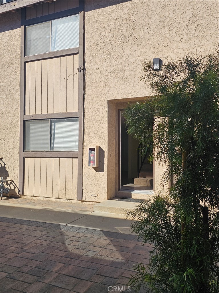 438 East Ave Q7, Unit B Palmdale, CA 93550 - Photo 1 of 26 a view of a house with a tree