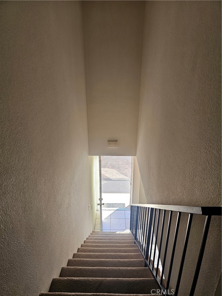 438 East Ave Q7, Unit B Palmdale, CA 93550 - Photo 12 of 26 a view of a hallway with wooden floor and a bathroom