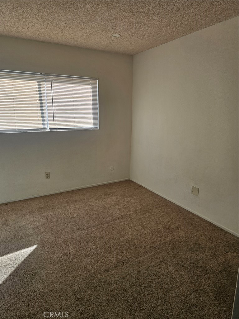 438 East Ave Q7, Unit B Palmdale, CA 93550 - Photo 17 of 26 a view of an empty room with a window