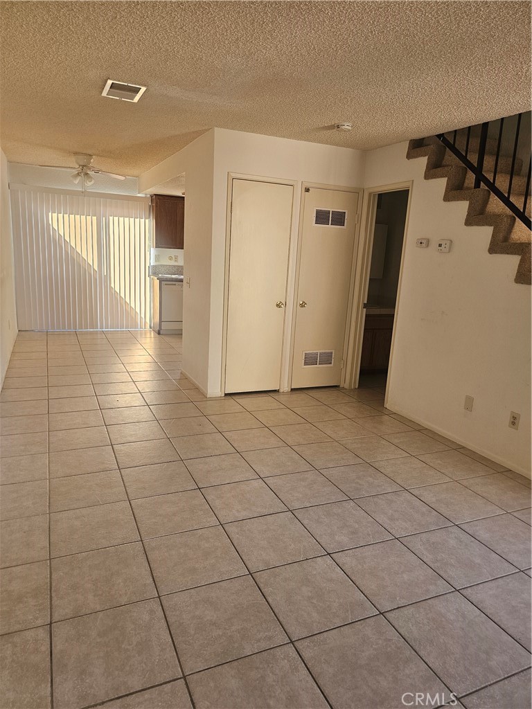 438 East Ave Q7, Unit B Palmdale, CA 93550 - Photo 22 of 26 a view of a livingroom with an empty space and a window