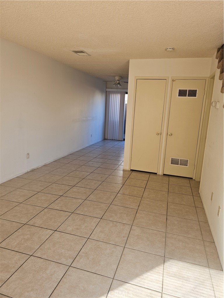 438 East Ave Q7, Unit B Palmdale, CA 93550 - Photo 4 of 26 a view of a livingroom with an empty space and a window