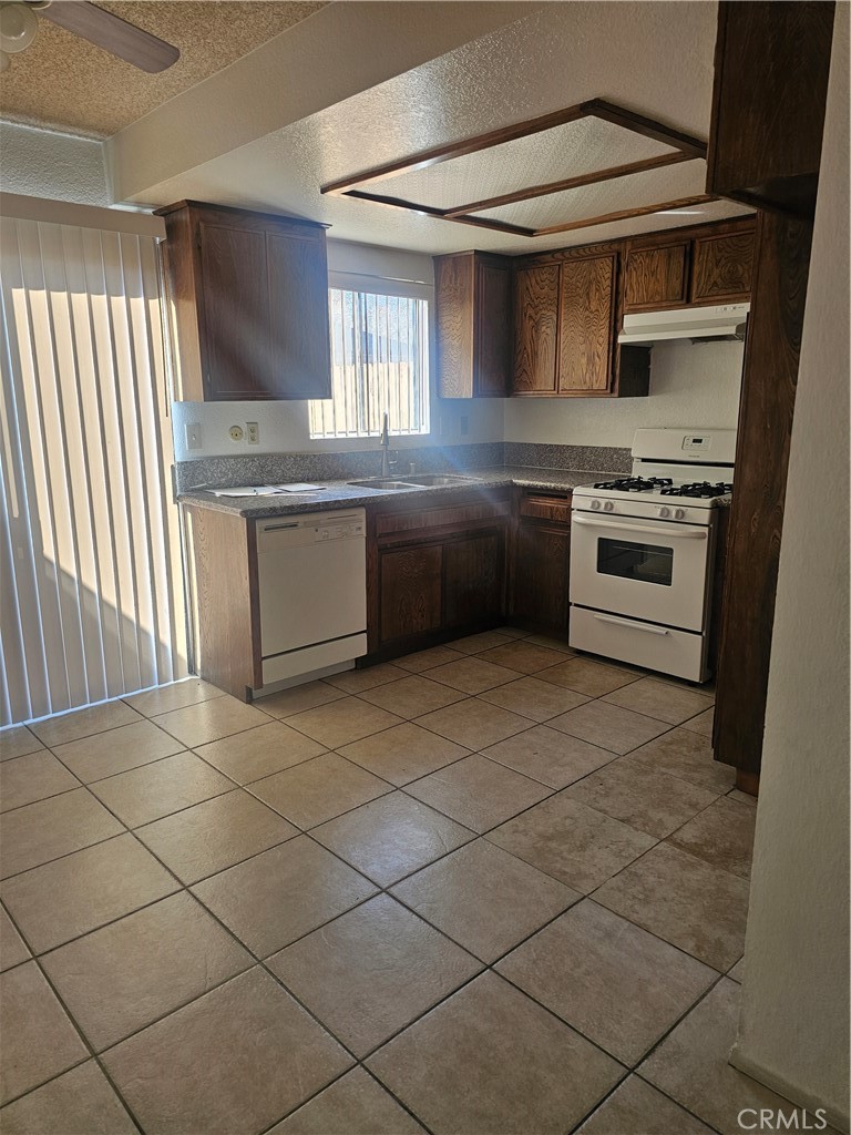 438 East Ave Q7, Unit B Palmdale, CA 93550 - Photo 5 of 26 a kitchen with stainless steel appliances and cabinets