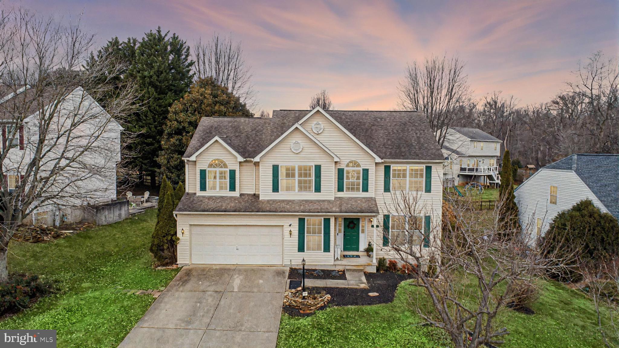 a view of house with yard outdoor seating and green space