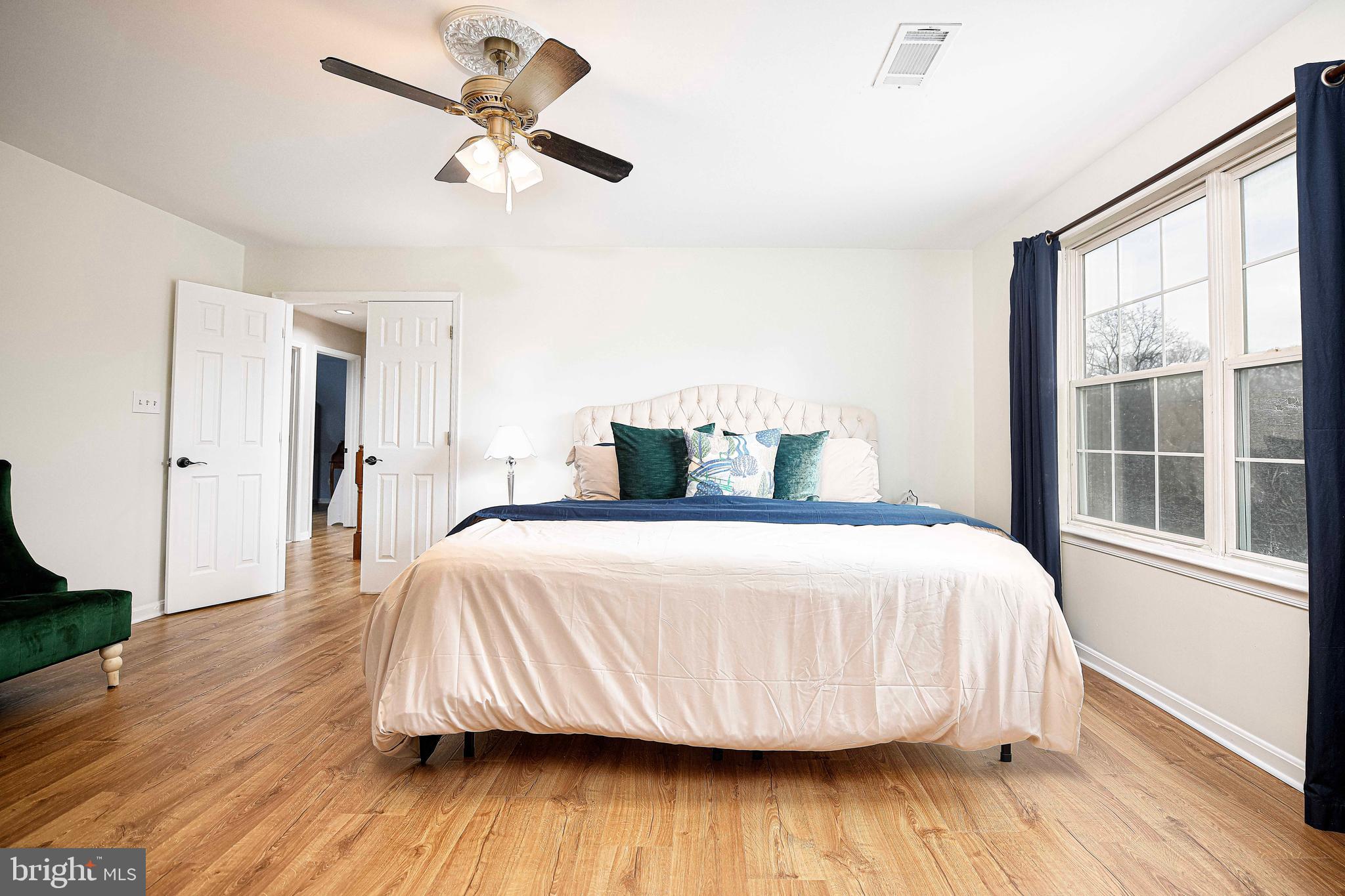 402 Hall Street Bel Air, MD 21014 - Photo 17 of 46 a bedroom with a bed and wooden floor