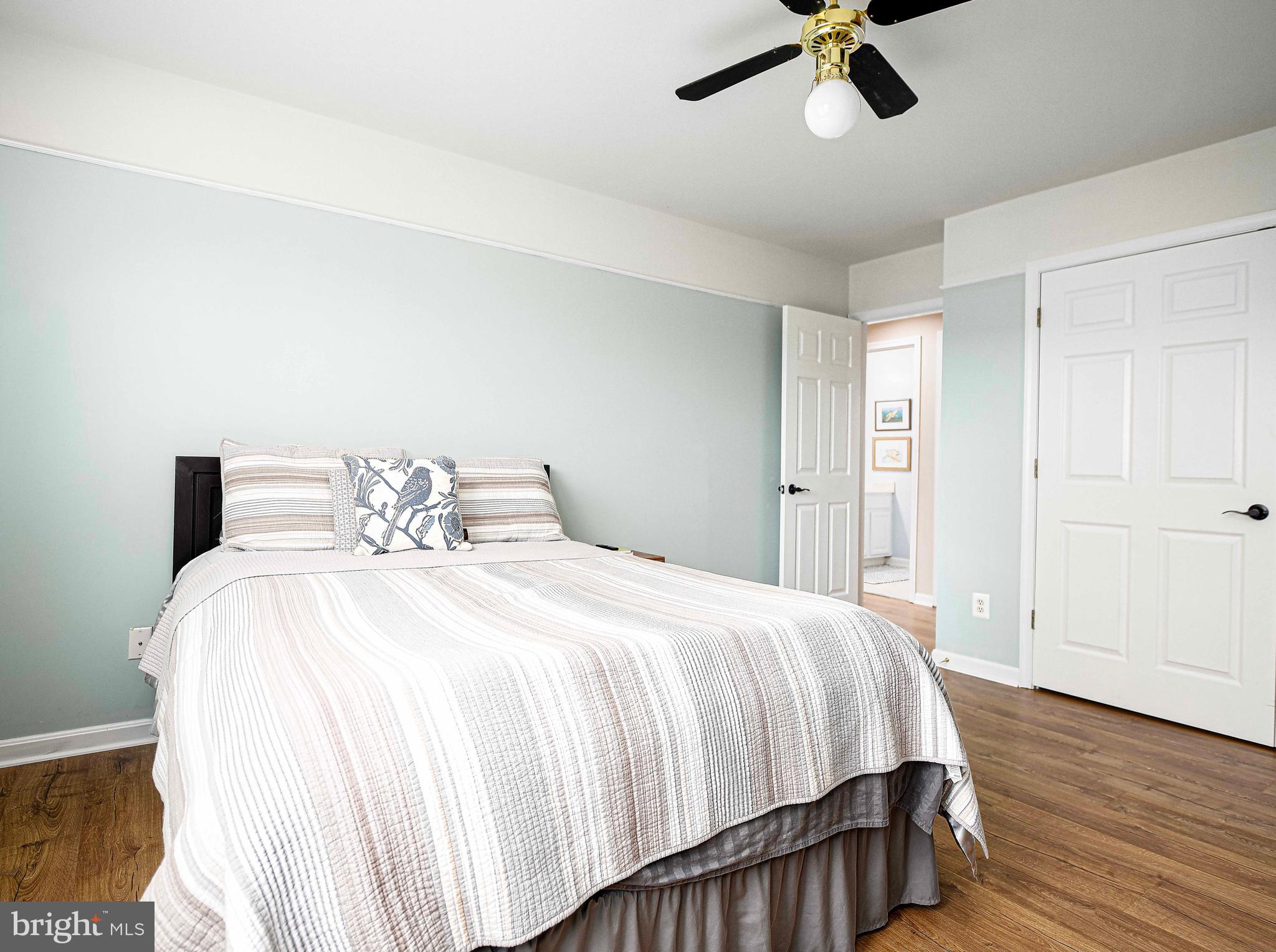 402 Hall Street Bel Air, MD 21014 - Photo 22 of 46 a bedroom with a bed and wooden floor