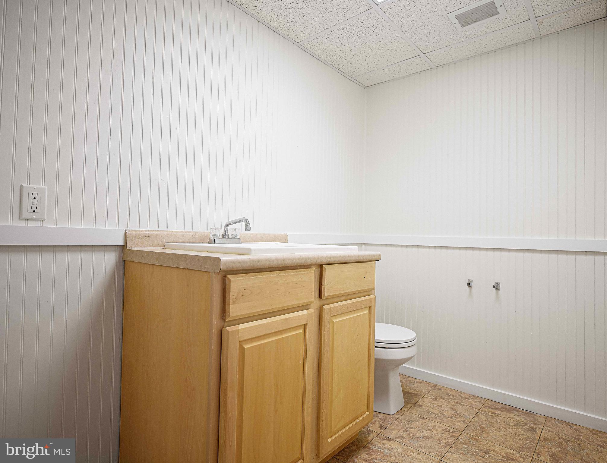 402 Hall Street Bel Air, MD 21014 - Photo 30 of 46 a bathroom with a sink a toilet and vanity