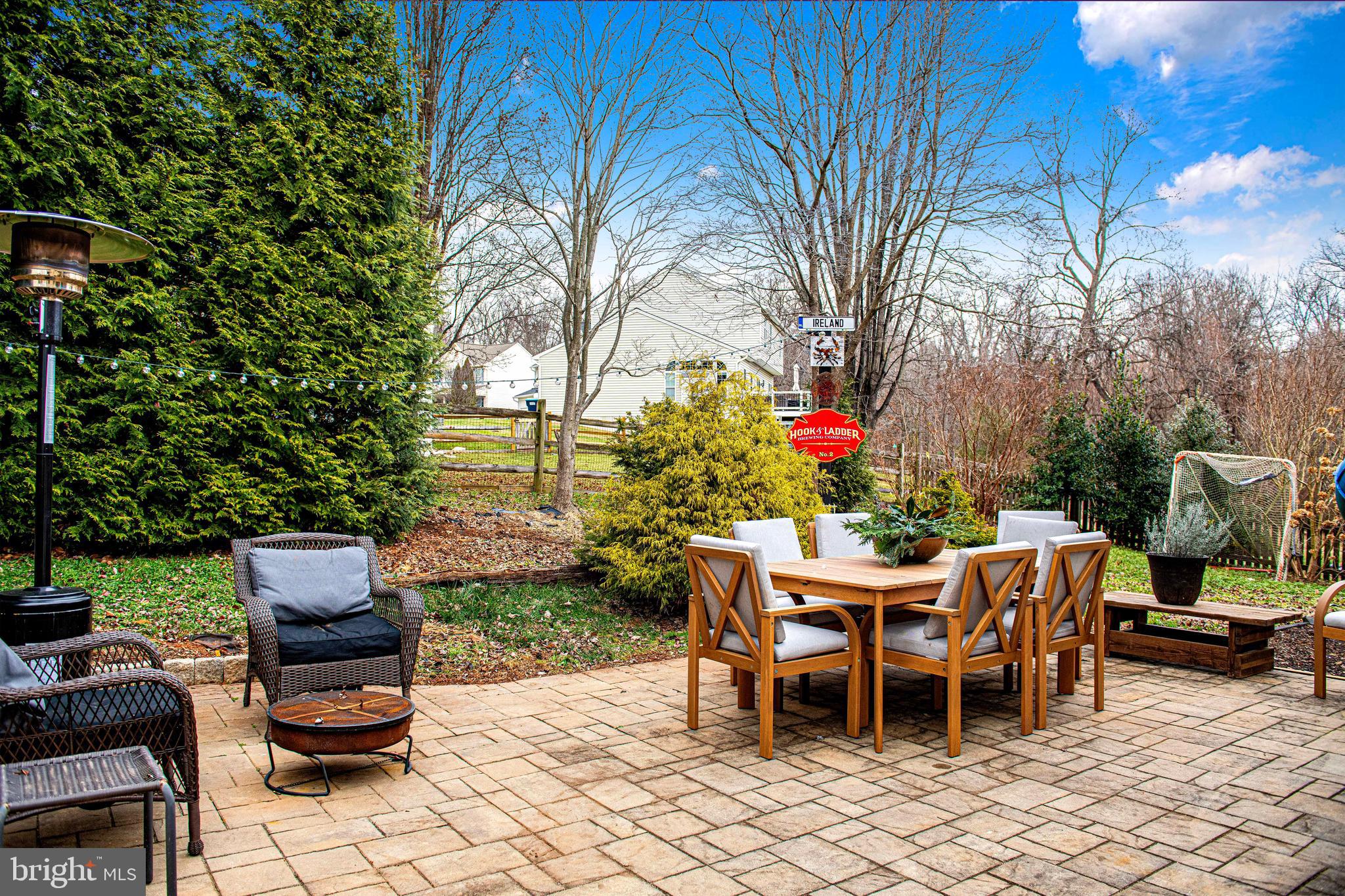 402 Hall Street Bel Air, MD 21014 - Photo 35 of 46 a backyard of a house with dining table and chairs