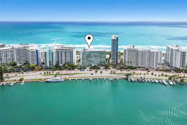 a view of swimming pool with outdoor seating and city view