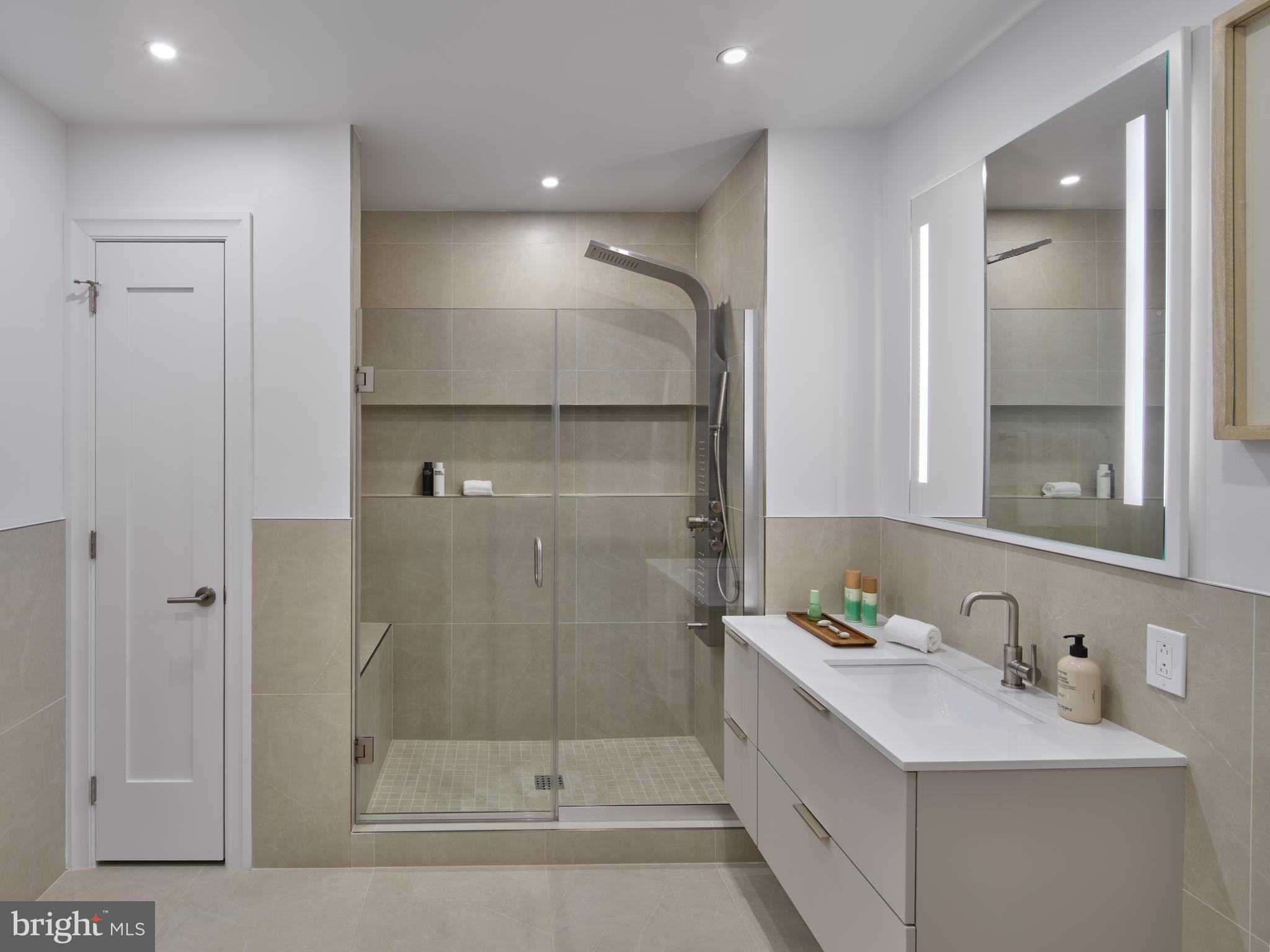 815-17 Poplar Street, Unit D Philadelphia, PA 19123 - Photo 3 of 15 a bathroom with a double vanity sink mirror and shower