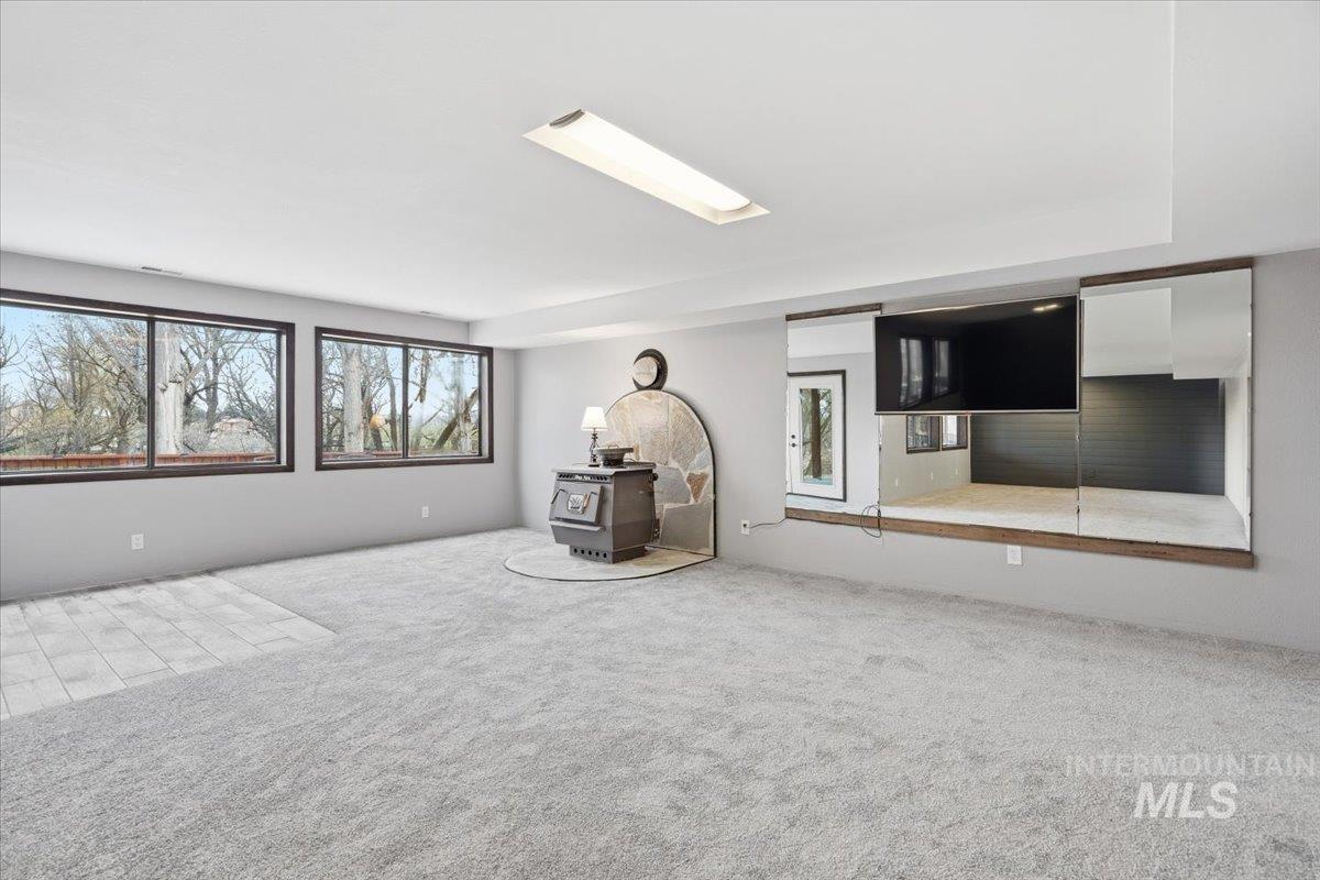 7771 Elmore Road Fruitland, ID 83619 - Photo 20 of 45 Bonus area with wood stove and patio access.