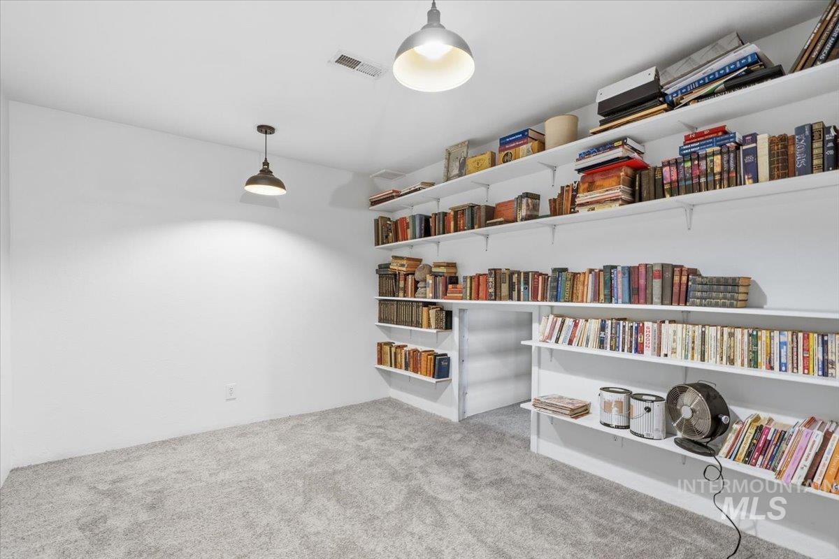 7771 Elmore Road Fruitland, ID 83619 - Photo 24 of 45 Office with hidden door underneath stairs.