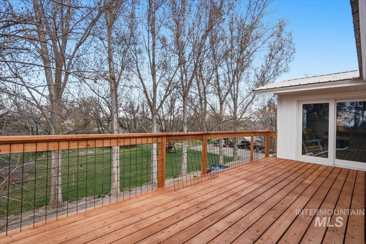 7771 Elmore Road Fruitland, ID 83619 - Photo 30 of 45 Deck with a yard