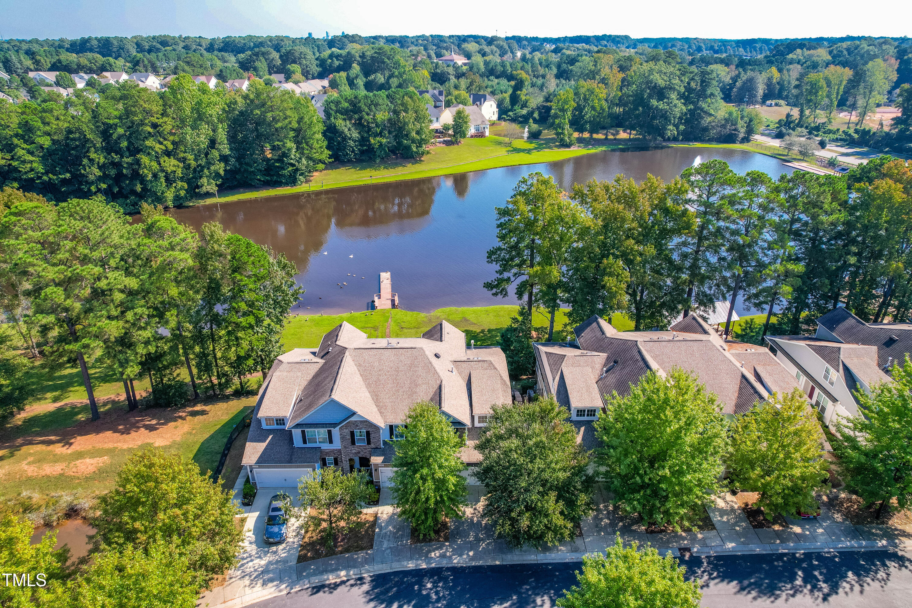 an aerial view of residential house with outdoor space and swimming pool